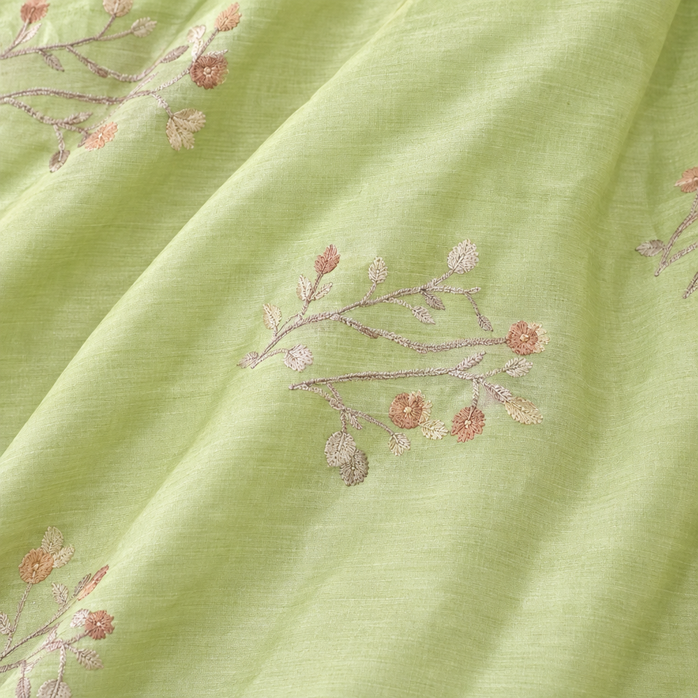 Close-up of the parrot green pure Tussar silk saree body with floral vine motifs