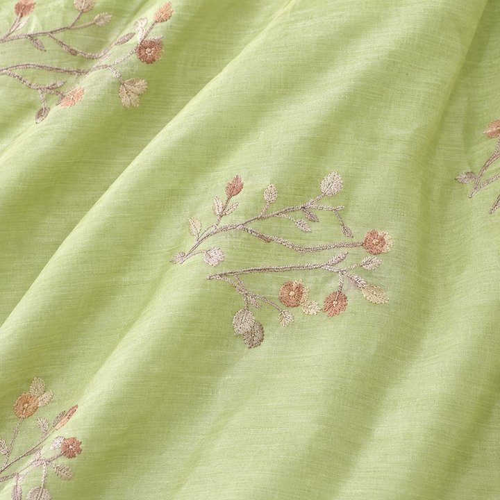 Close-up of the parrot green pure Tussar silk saree body with floral vine motifs