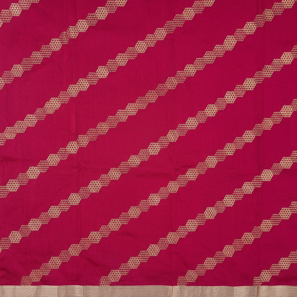 Close-up of diagonal metallic-toned geometric motif bands on dark pink silk