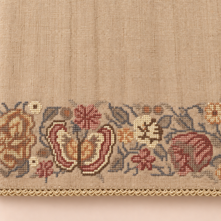 Close-up of the beige saree's butterfly and floral border with cream trim
