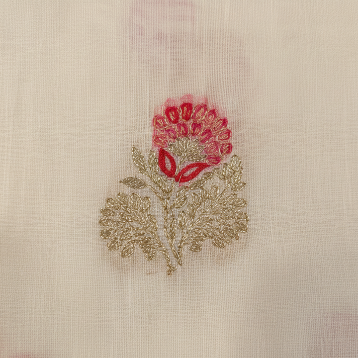 Close-up of pink red and gold floral motif woven on cream semi tussar silk