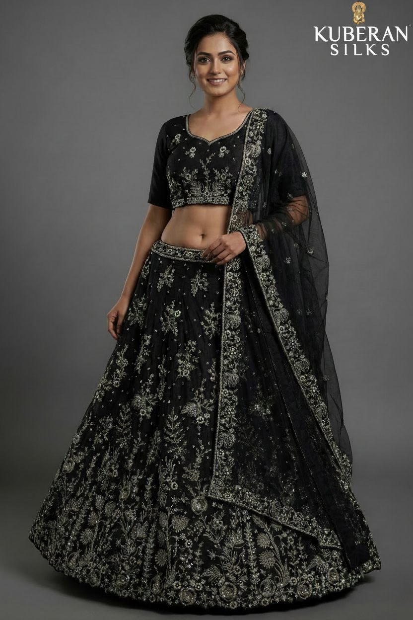 Black embroidered net lehenga set with silver sequin work and Kuberan logo