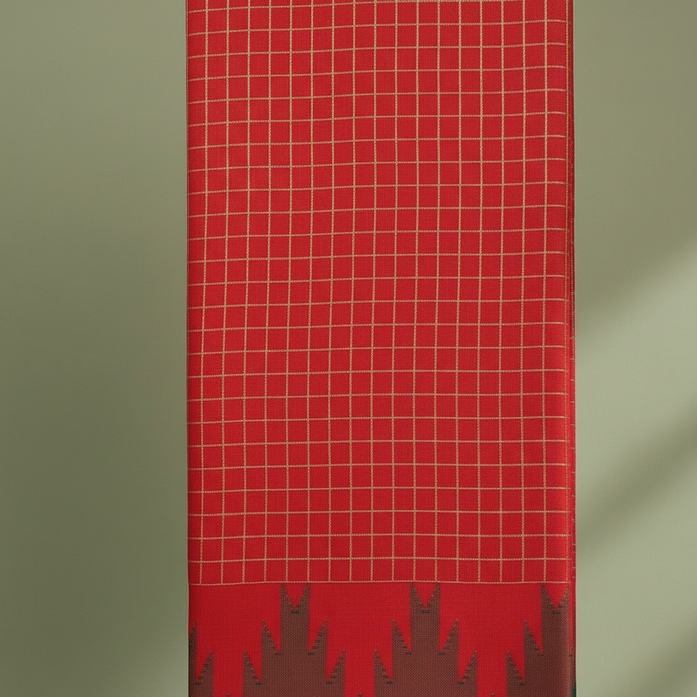 Close-up of the vivid red and scarlet cotton saree with its fine pale-gold checked grid