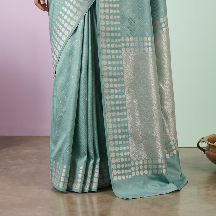 Close-up of the sea blue Banarasi silk saree silver geometric border and woven pallu