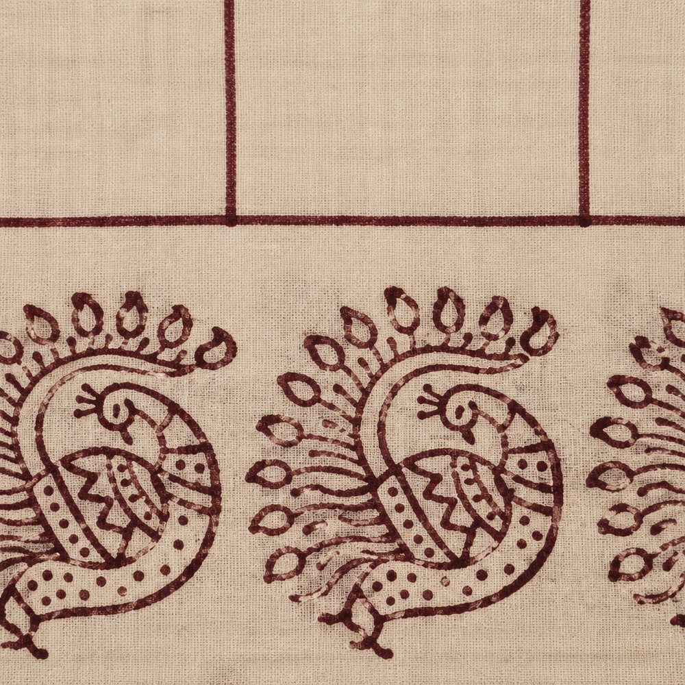Close-up of peacock print border on cream cotton dance saree