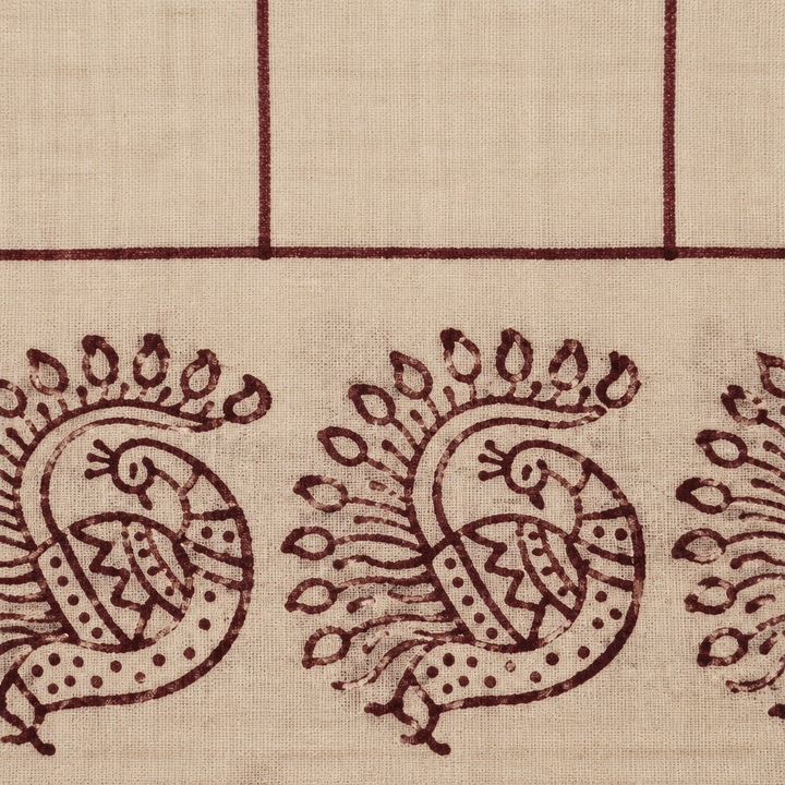 Close-up of peacock print border on cream cotton dance saree