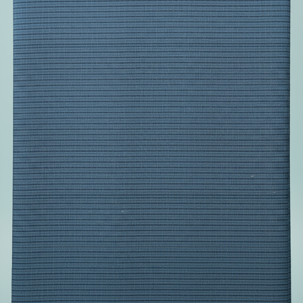 Close-up of the steel-blue and slate-blue cotton saree showing its fine horizontal striated weave and subtle tonal bands