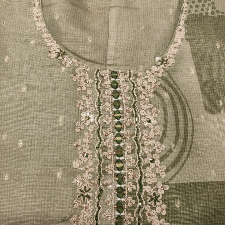 Close-up of white floral lace and mirror work neckline
