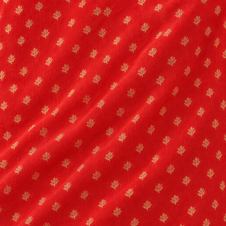 Close-up of the red Banaras georgette saree body with fine gold butti motifs