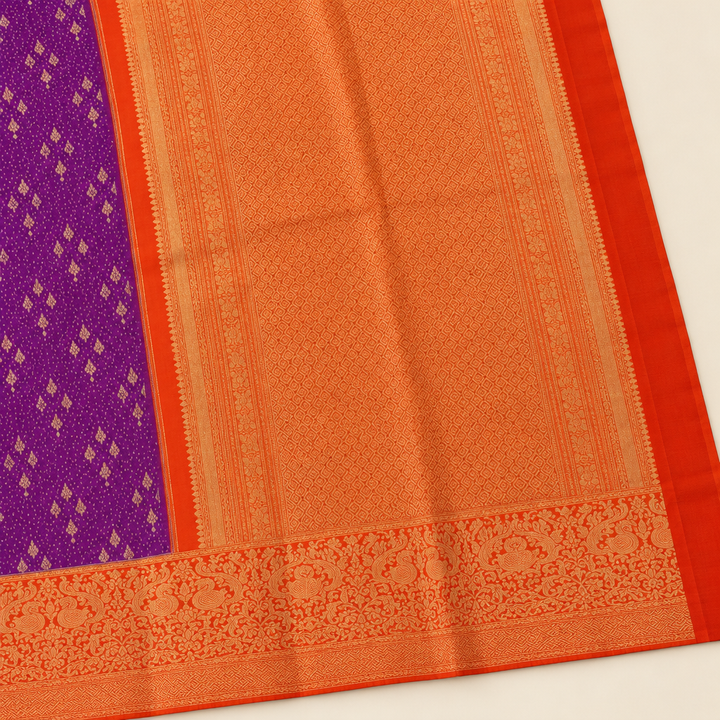 Close-up of orange-gold contrast pallu and woven border of purple pure silk saree