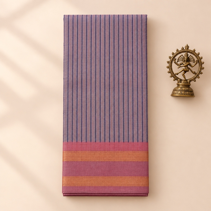 Lilac striped cotton dance saree with pink border, folded flat lay with Nataraja prop
