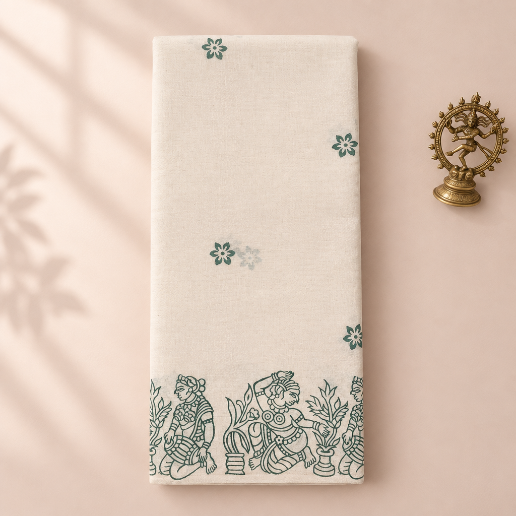 Cream cotton dance saree with green dancer print border, folded flat lay with Nataraja prop