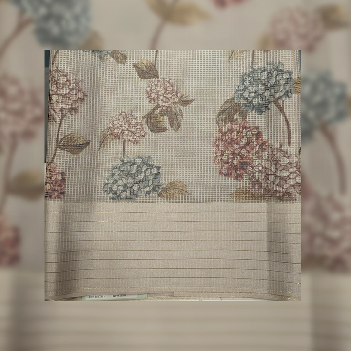 Close-up of the ivory cream Kota cotton saree striped border and floral pallu