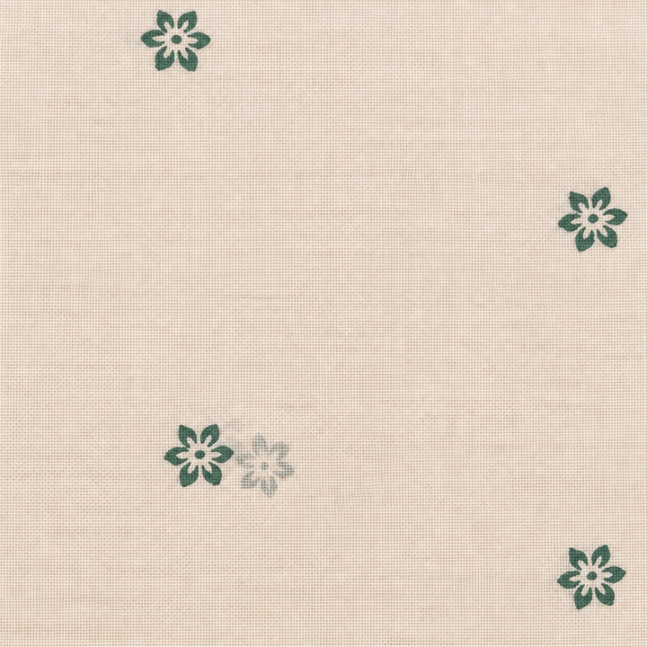 Close-up of green flower buta on cream cotton saree body