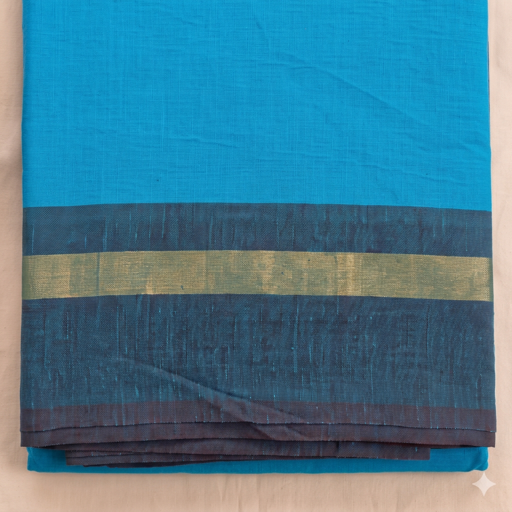 Dark blue border with gold-toned stripe on turquoise cotton dance saree, close-up