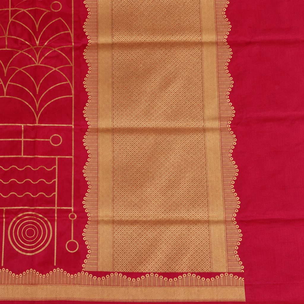 Close-up of red saree's textured gold-toned pallu panel and scalloped edging