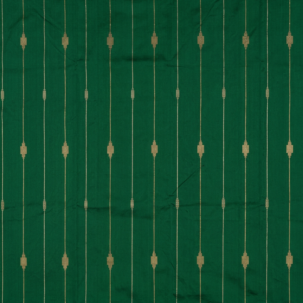 Close-up of fine gold-toned lines and geometric motifs on green silk