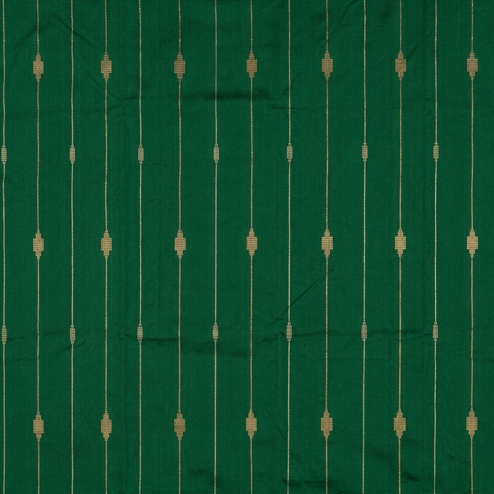 Close-up of fine gold-toned lines and geometric motifs on green silk