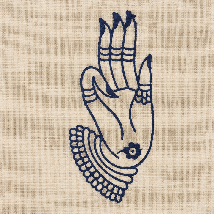 Close-up of navy hand-mudra print border on cream cotton dance saree