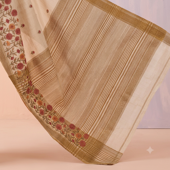 Fine gold-toned stripes and red floral detailing on an off-white saree pallu