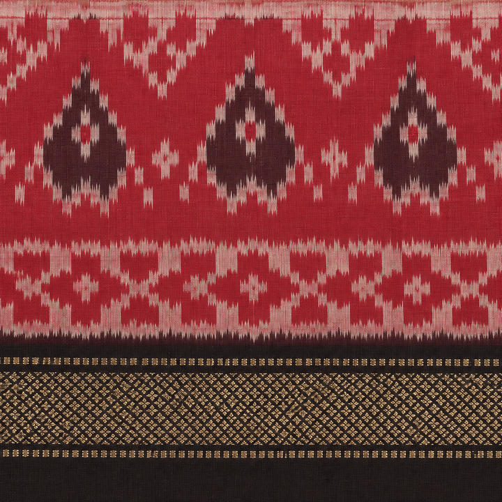 Close-up of red ikat paisley border and black gold zari edge on Pochampally silk saree