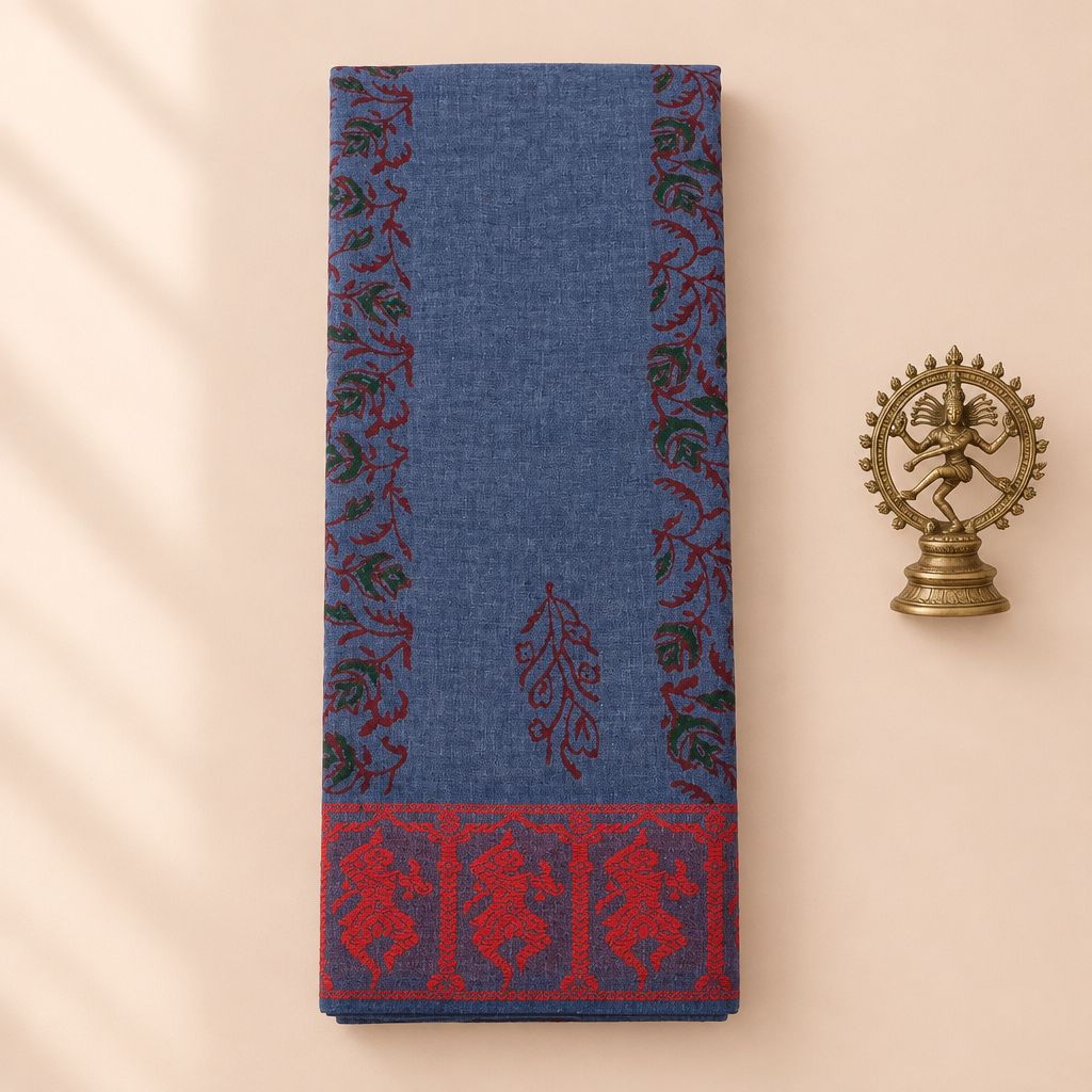 Blue cotton dance saree with red dancer border, folded flat lay with Nataraja prop