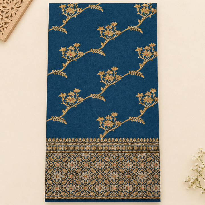 Close-up of gold floral vines on navy blue Tussar silk saree
