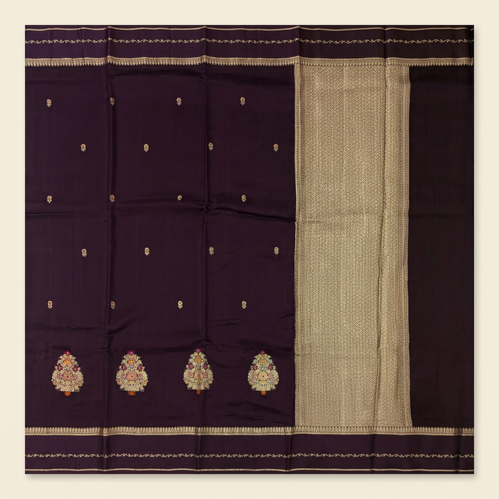 Full straight view of dark brown chiffon saree with small gold-toned butis ornate motifs and patterned pallu