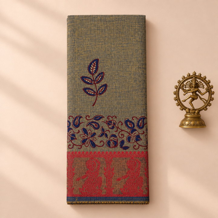 Olive grey cotton dance saree with paisley print and red border, folded flat lay with Nataraja prop