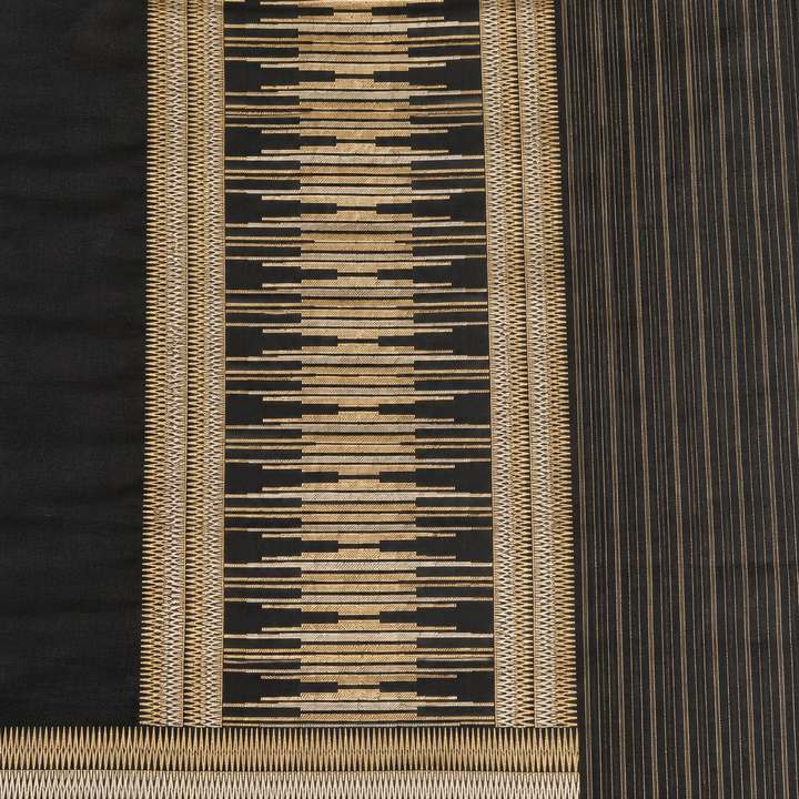 Detail view of black and gold-toned geometric pallu and striped edge