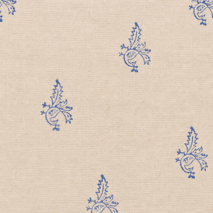Close-up of blue bird buta on cream cotton saree body