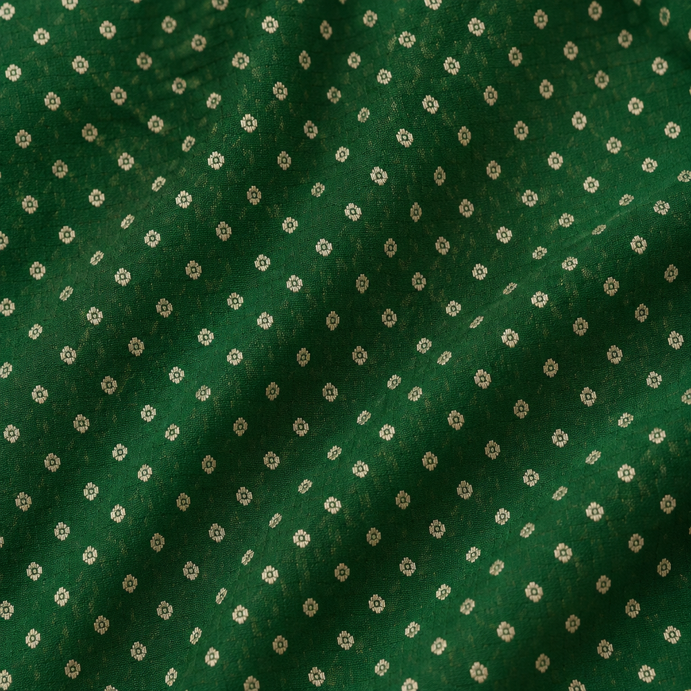 Close-up of the green Banaras georgette saree body with fine white dotted butti motifs