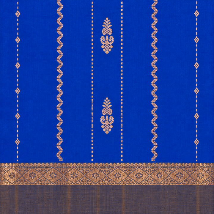 Close-up of blue pure silk saree body with gold floral motifs and wave-like zari details