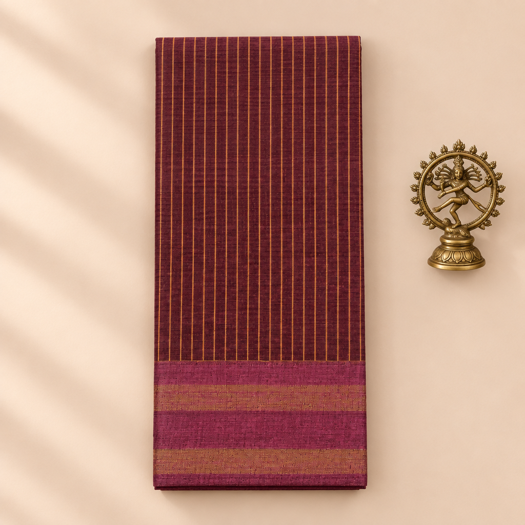 Plum maroon striped cotton dance saree, folded flat lay with Nataraja prop