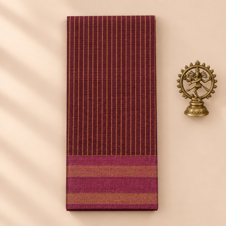 Plum maroon striped cotton dance saree, folded flat lay with Nataraja prop