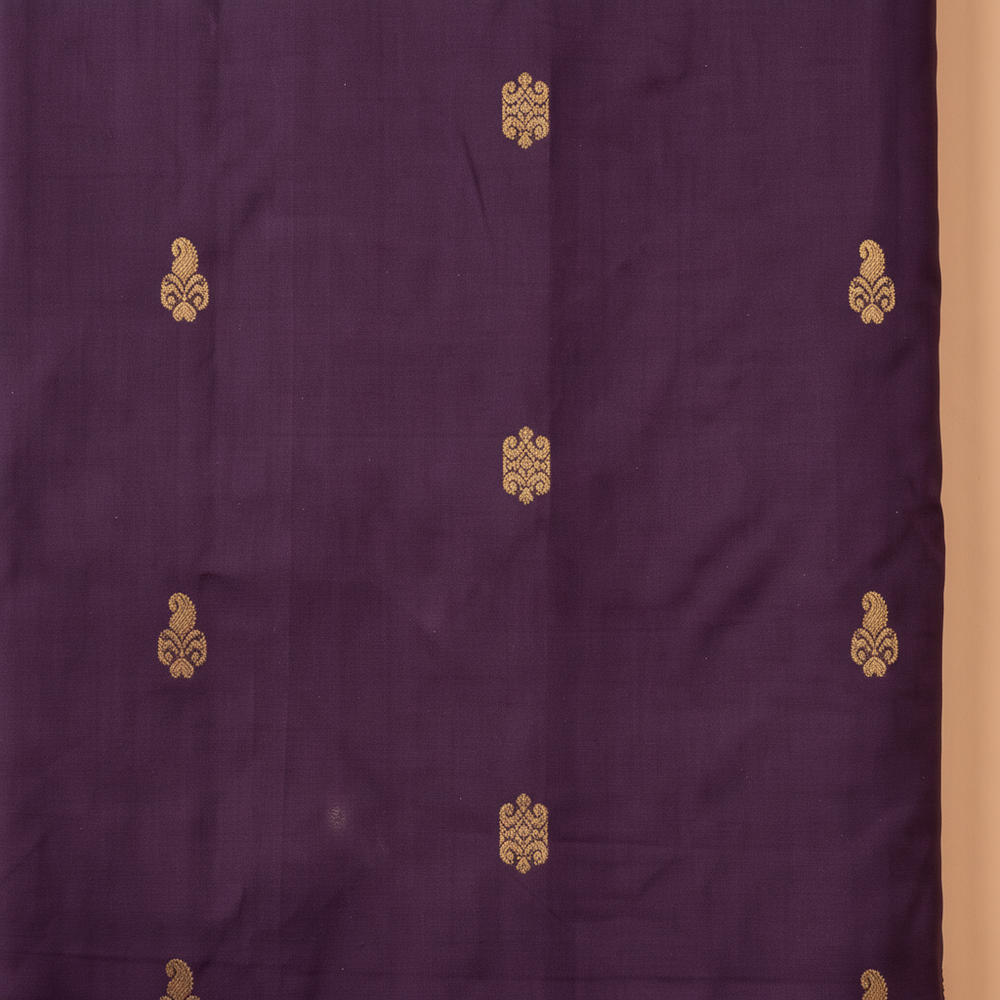 Deep purple pure silk saree body with gold zari motifs close-up
