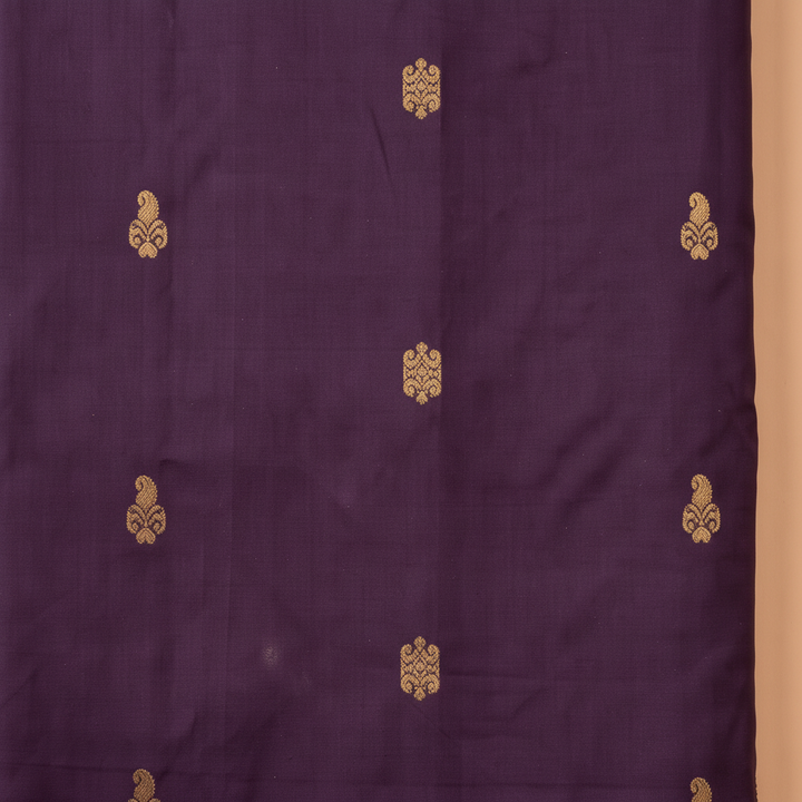 Deep purple pure silk saree body with gold zari motifs close-up