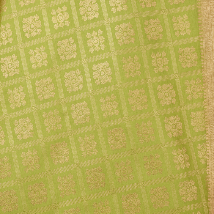 Close-up of lime green silk saree body with gold zari floral brocade squares
