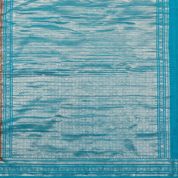 Close-up of turquoise-blue and silver-toned geometric pallu