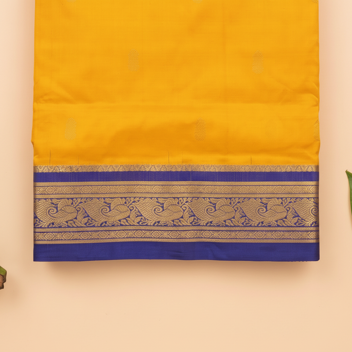 Royal-blue zari border on a mango-yellow 9-yard pure silk saree close-up