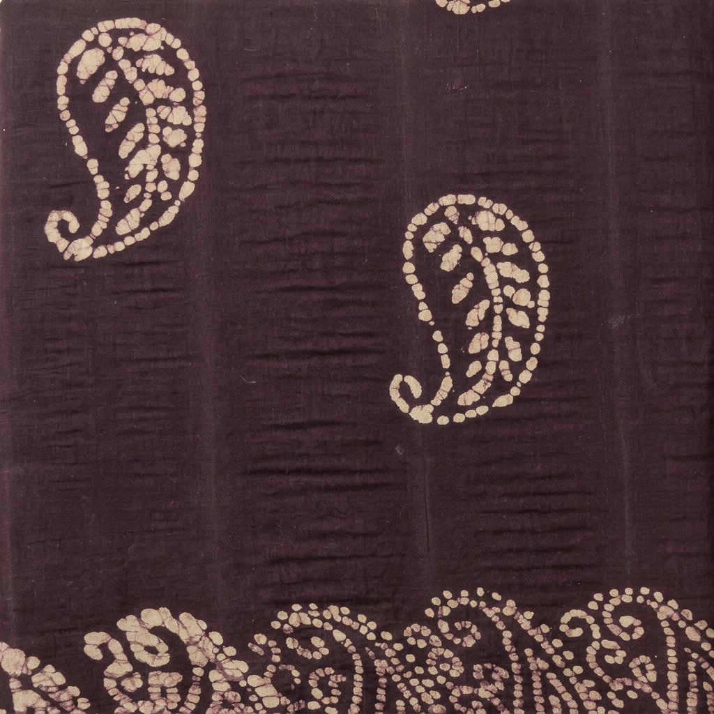 Cream paisley motifs on deep purple cotton dance saree, body close-up