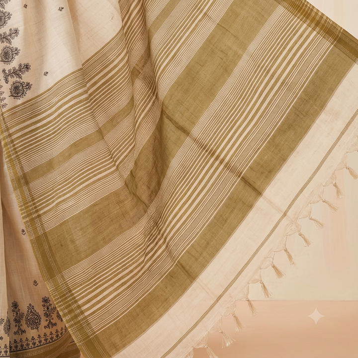 Gold-olive broad bands and fine stripes on an off-white saree pallu with cream tassels