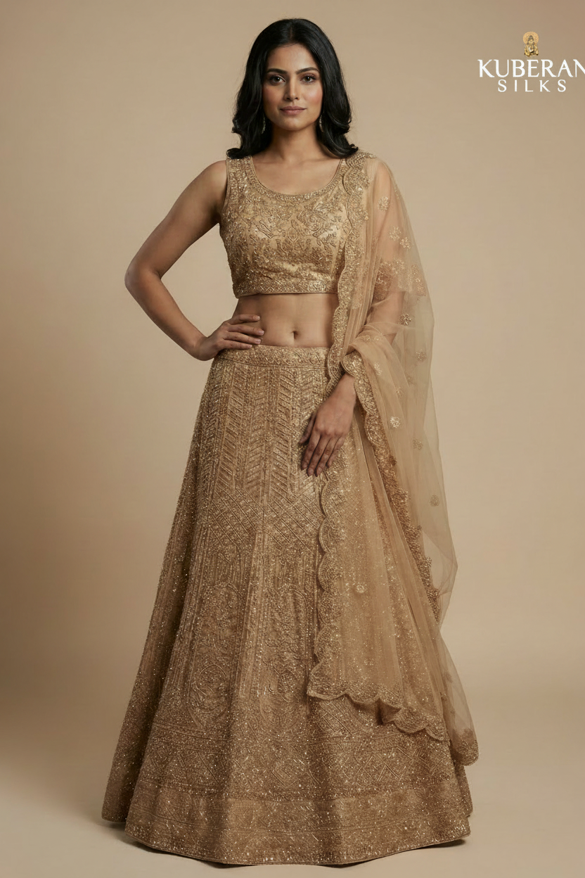 Golden beige embroidered net lehenga set with sequin work and Kuberan logo
