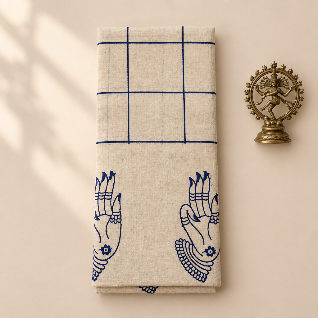 Cream cotton dance saree with navy checks and mudra border, folded flat lay with Nataraja prop