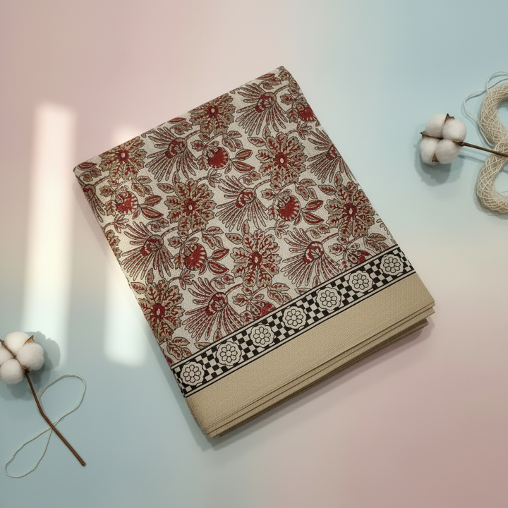 Beige and red Chanderi cotton saree close-up showing the red border and pallu