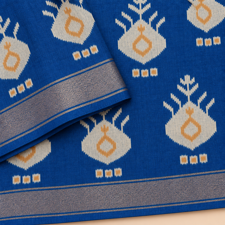 Close-up of blue Pochampally silk saree with Ikat checks and zari border