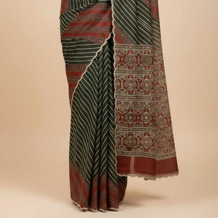 Red and green pure satin crepe silk saree close-up showing the border and pallu