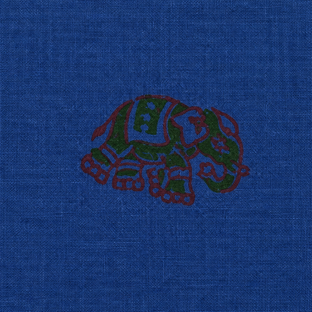 Close-up of maroon floral buta on royal blue cotton saree body