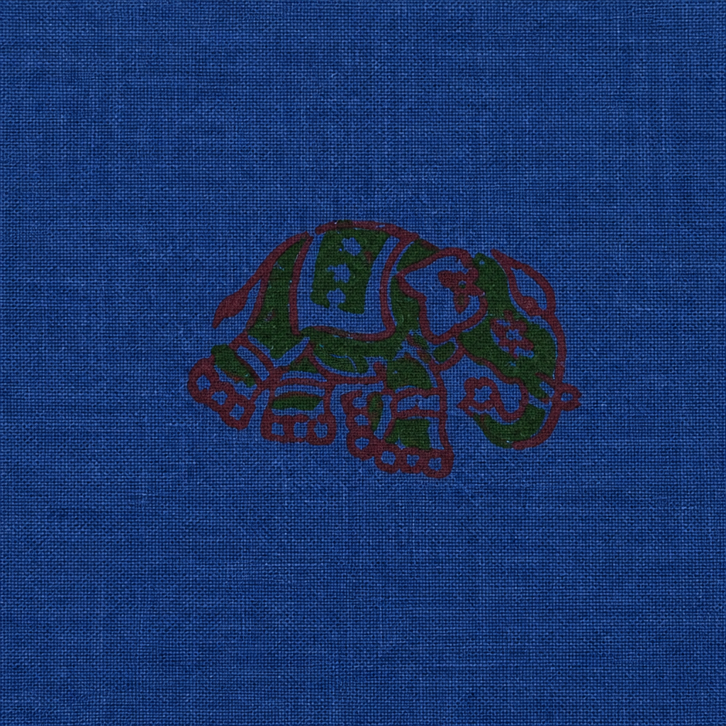 Close-up of maroon floral buta on royal blue cotton saree body