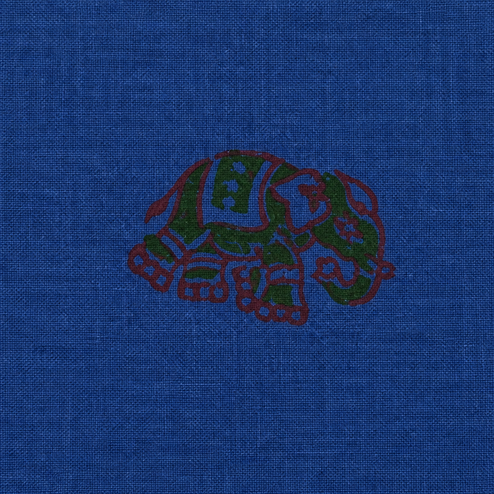 Close-up of maroon floral buta on royal blue cotton saree body